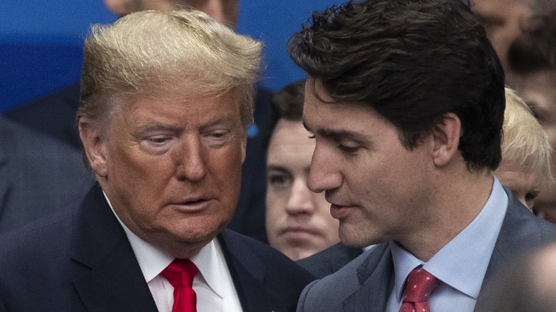 Donald Trump and Justin Trudeau share a tender moment at the NATO summit in Watford, England (2019)