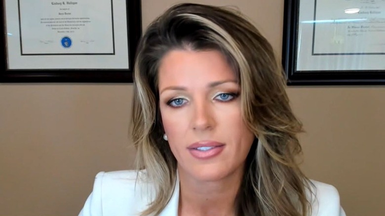 Lindsey Halligan frowning while speaking with Real America's Voice in October 2023