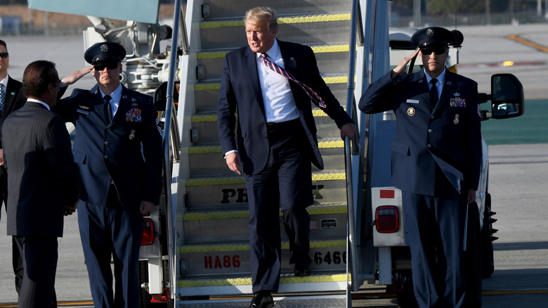 Donald Trump walking down Air Force One stairs