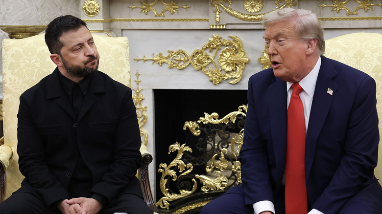 Donald Trump speaks to Volodymyr Zelenskyy in the Oval Office in a suit