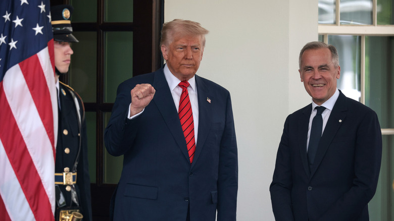 Donald Trump stands with Mark Carney
