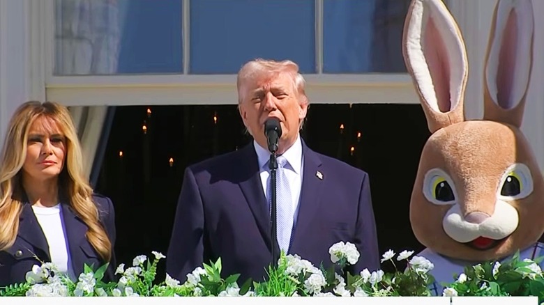 Melania Trump, Donald Trump, and the Easter Bunny stand on the White House balcony during the Easter 2026 White House egg roll event.