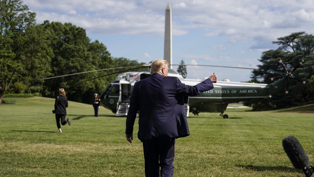Back of Trump, thumbs up
