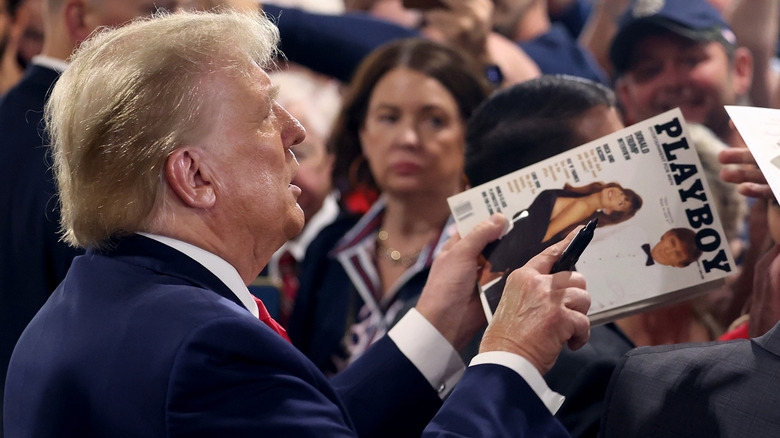 Donald Trump with marker and Playboy magazine