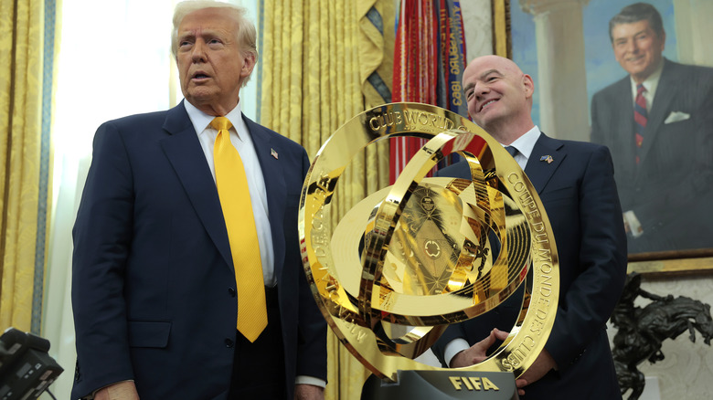 President Donald Trump speaks alongside FIFA president Gianni Infantino after unveiling the 2025 Club World Cup trophy in the Oval Office at the White House on March 07, 2025