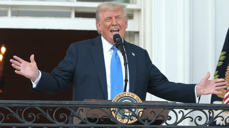 Donald Trump talking and holding out his hands