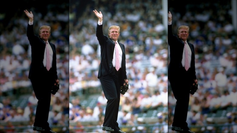 Donald Trump waving to the crowd before throwing out the first pitch at a game in 2000