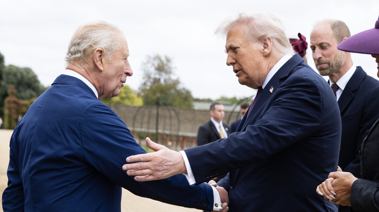 King Charles III shaking hands with Donald Trump