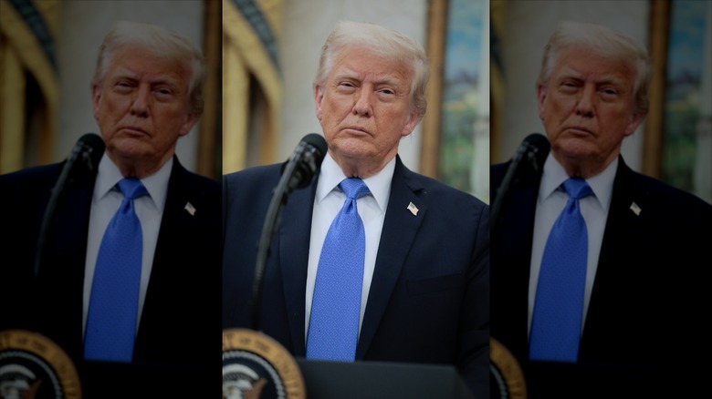 Donald Trump stands at a podium