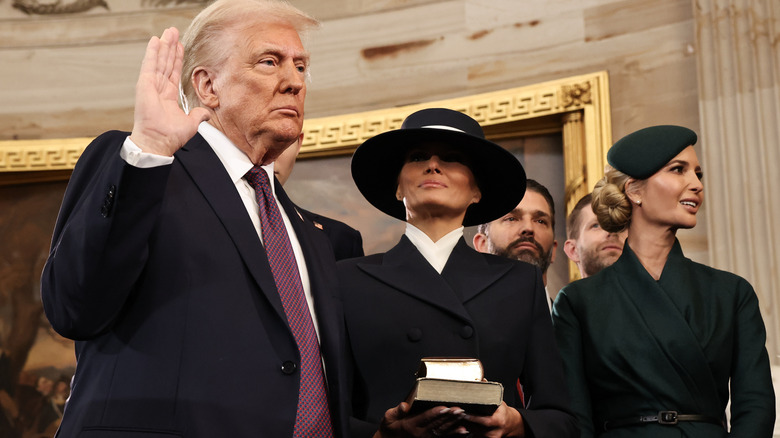Donald Trump takes the oath of office as his wife Melania and his children look on during inauguration ceremonies in the Rotunda of the U.S. Capitol in Washington, DC (2025)