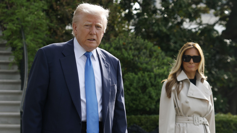 Donald Trump and Melania Trump walking near each other