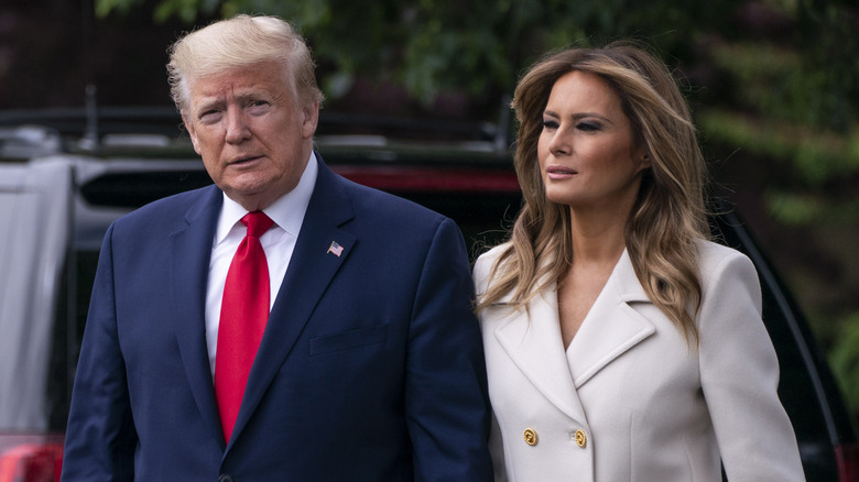 Donald and Melania Trump walking