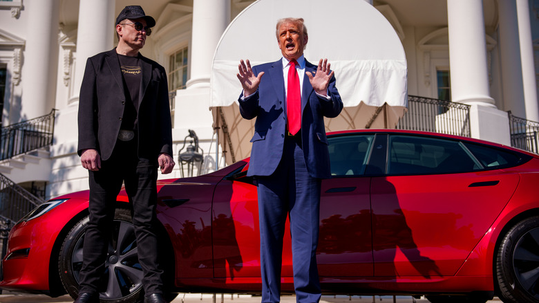 Elon Musk and President Donald Trump in front of a Tesla Model S