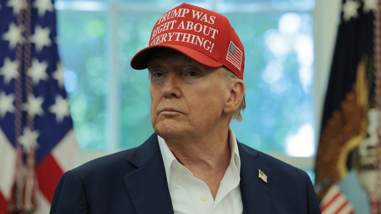 Donald Trump wearing a red hat