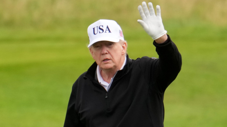 Donald Trump waving in USA cap
