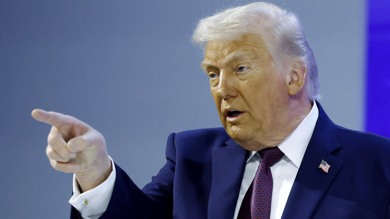 image of Donald Trump mid-sentence while pointing his index finger