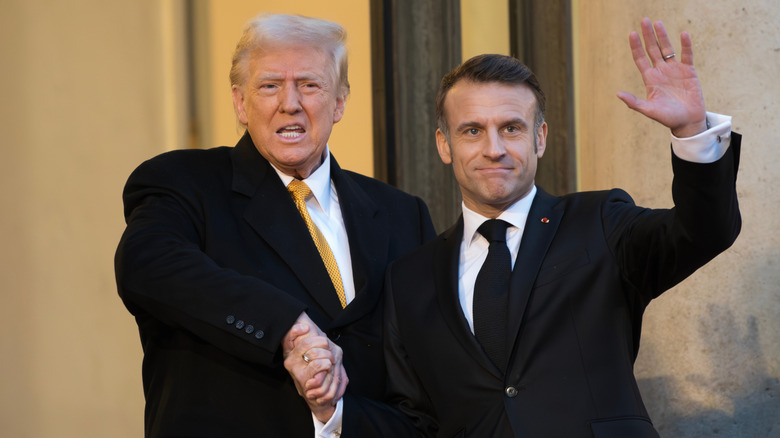 Donald Trump awkwardly shakes hands with Emmanuel Macron