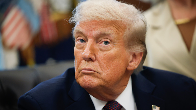 Donald Trump looking at someone with wide eyes