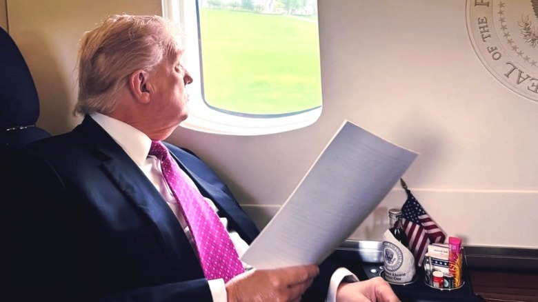 Donald Trump looking out airplane window