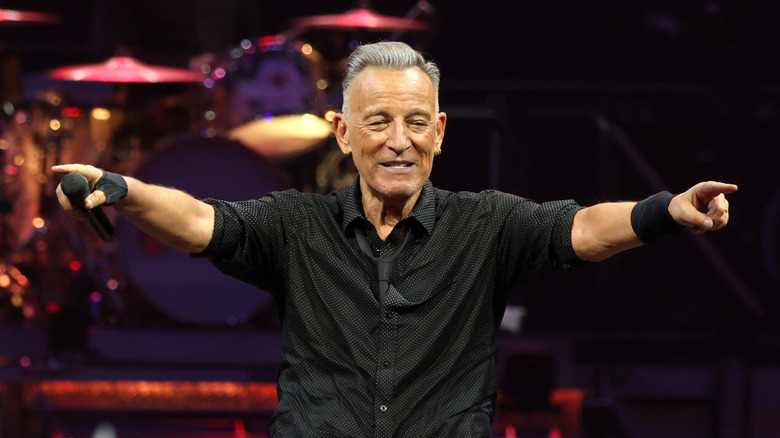 Bruce Springsteen stretching out his arms