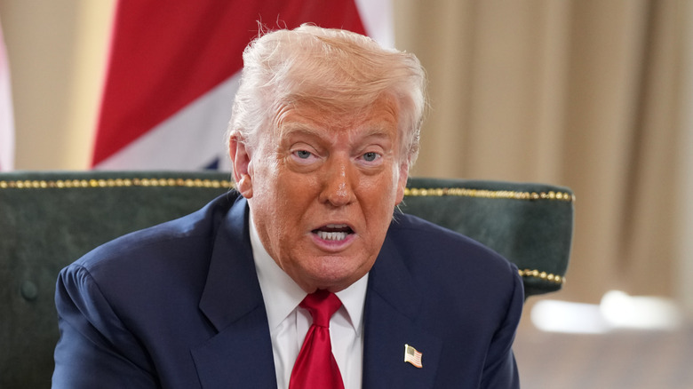 Donald Trump speaking at a meeting.