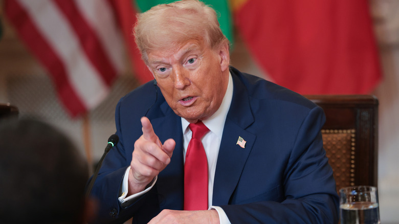 Donald Trump points while talking