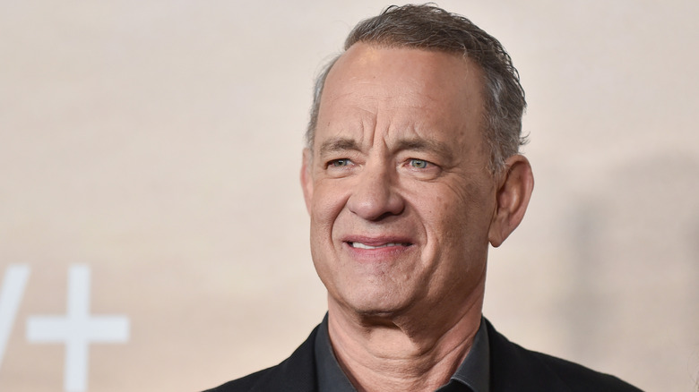 Tom Hanks smiling at a red carpet event