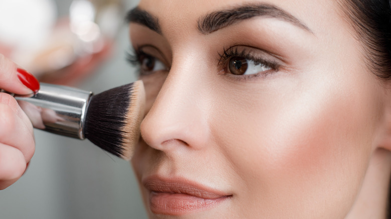 Woman getting her makeup done