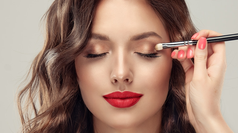 Woman getting her makeup done