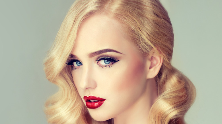 Blond woman with bold red lips Hollywood glamour