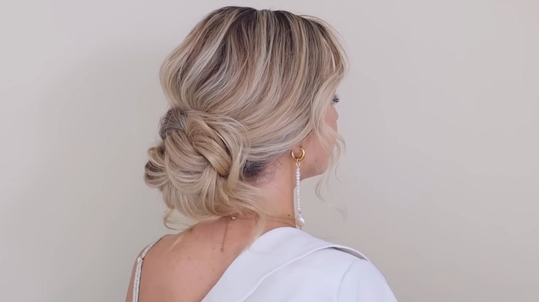 blonde woman with low messy bun