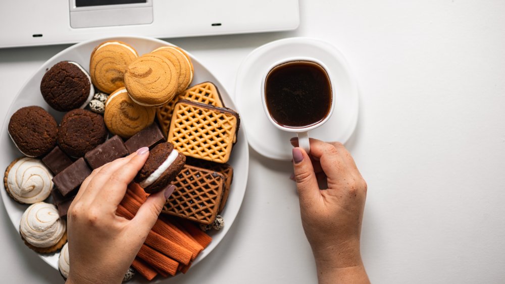 eating a plate of cookies in front of the computer, stress-eating