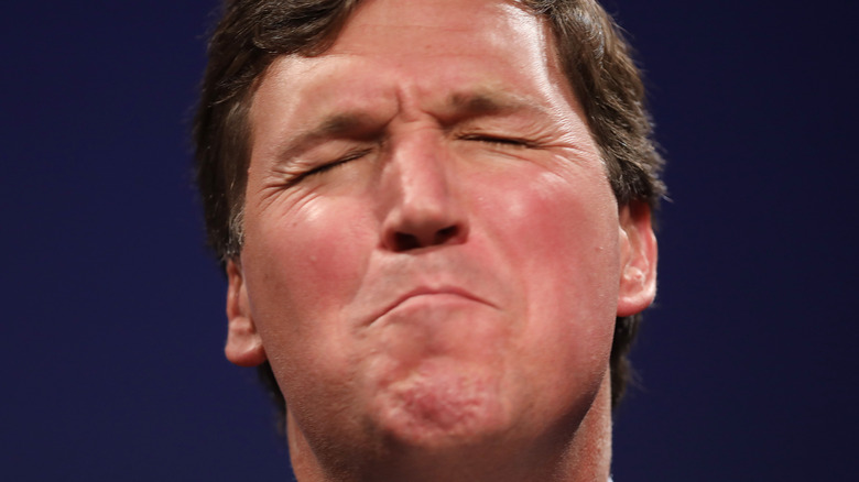 Tucker Carlson making face