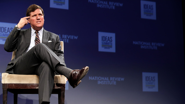 Tucker Carlson speaking at event