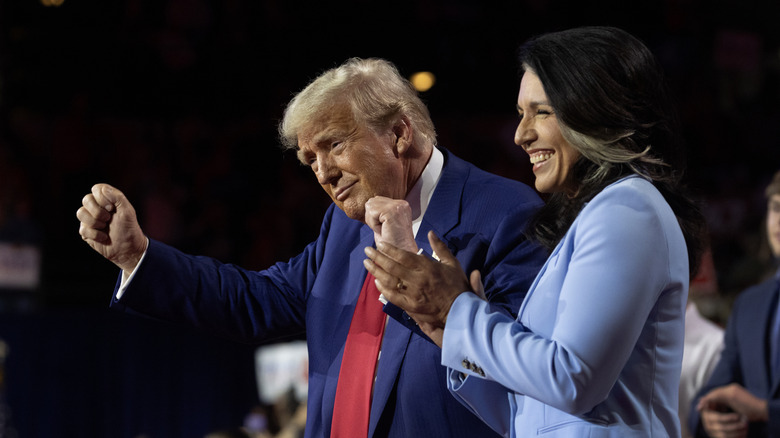 Once a rising star of the left, Tulsi Gabbard started her political career as a member of the Democratic Party representing Hawaii in Congress. In 2022, Gabbard took to X, then Twitter to announce her decision to leave the party and become an independent, calling the DNC "an elitist cabal of warmongers driven by cowardly wokeness." By 2024, Gabbard had become a member of the Republican Party and endorsed Donald Trump during his third run for the presidency. In return, she was named the Director of National Intelligence. By March 2026, her relationship with Trump, and her position in his administration, may have completely destroyed Gabbard's reputation.  Gabbard has long been against going to war with Iran, posting on X in 2020 that she was against Trump's actions against the country, saying "Stand with me against Trump's Iran War!" Six years later, Gabbard would find herself sitting before the Senate intelligence committee trying to walk the thin line between saying what the president wants to hear about the war in Iran and making it clear that those statements do not represent her own feelings. She was also called out for changing her opening statement to remove a comment that Iran was not working to rebuild their nuclear program, which would go directly against what the president had claimed. Along with that, Gabbard's refusal to say that Iran posed an imminent threat to the U.S. will likely upset Trump, and could lead to Gabbard being thrown under the proverbial bus.