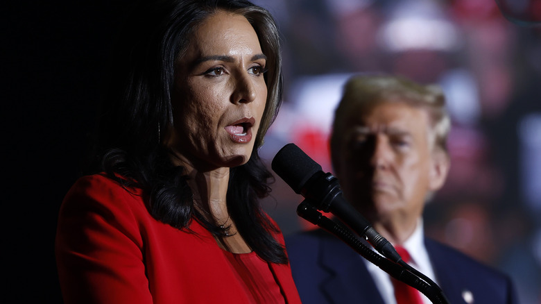 Once a rising star of the left, Tulsi Gabbard started her political career as a member of the Democratic Party representing Hawaii in Congress. In 2022, Gabbard took to X, then Twitter to announce her decision to leave the party and become an independent, calling the DNC "an elitist cabal of warmongers driven by cowardly wokeness." By 2024, Gabbard had become a member of the Republican Party and endorsed Donald Trump during his third run for the presidency. In return, she was named the Director of National Intelligence. By March 2026, her relationship with Trump, and her position in his administration, may have completely destroyed Gabbard's reputation.  Gabbard has long been against going to war with Iran, posting on X in 2020 that she was against Trump's actions against the country, saying "Stand with me against Trump's Iran War!" Six years later, Gabbard would find herself sitting before the Senate intelligence committee trying to walk the thin line between saying what the president wants to hear about the war in Iran and making it clear that those statements do not represent her own feelings. She was also called out for changing her opening statement to remove a comment that Iran was not working to rebuild their nuclear program, which would go directly against what the president had claimed. Along with that, Gabbard's refusal to say that Iran posed an imminent threat to the U.S. will likely upset Trump, and could lead to Gabbard being thrown under the proverbial bus.