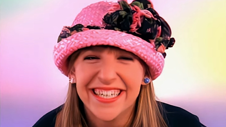 Mayim Bialik as Blossom wearing a pink hat in the sitcom Blossom