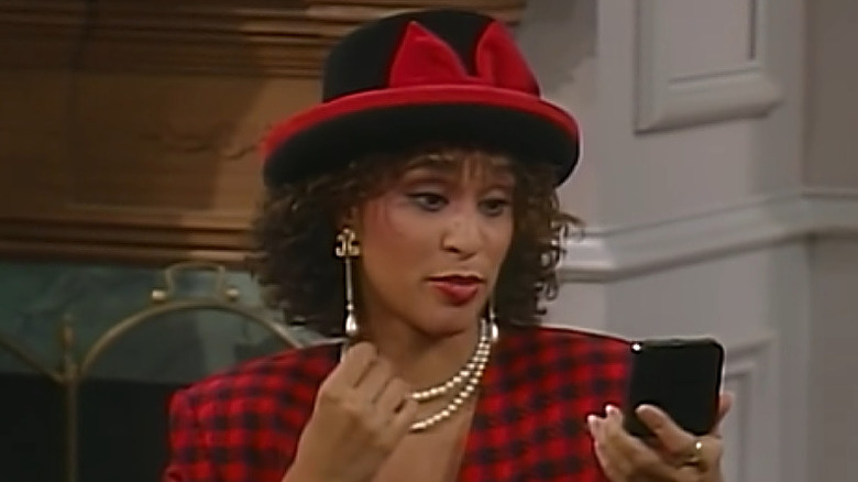 Karyn Parsons Rockwell as Hilary Banks wearing red and black on Fresh Prince of Bel-Air