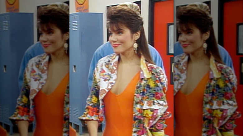 Tiffani-Amber Thiessen as Kelly Kapowski on Saved by the Bell wearing a floral jacket