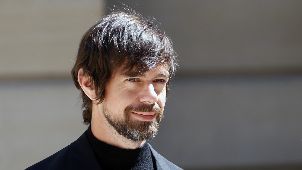 Jack Dorsey smiling in black turtleneck