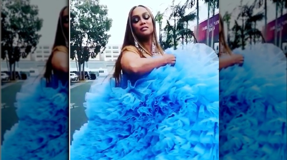 Tyra Banks in a light blue gown 