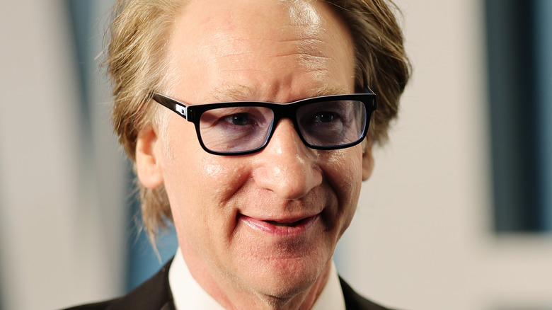 Bill Maher wearing glasses