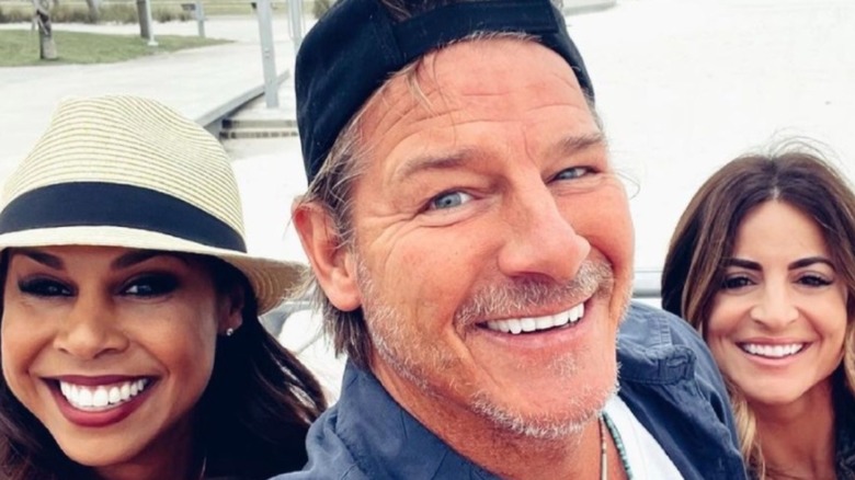 Ty Pennington smiling with two women