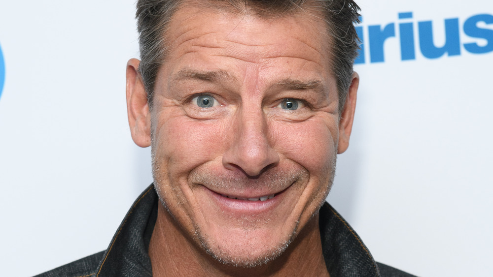 Ty Pennington smiling with facial scruff