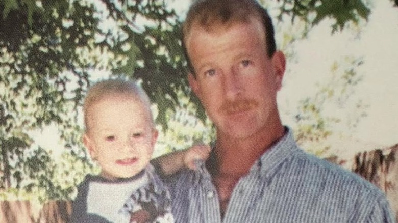 Tyler Henry's dad holing him as a baby