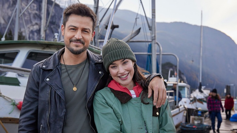 Tyler Hynes and Rhiannon Fish posing together on the set of "A Picture of Her"