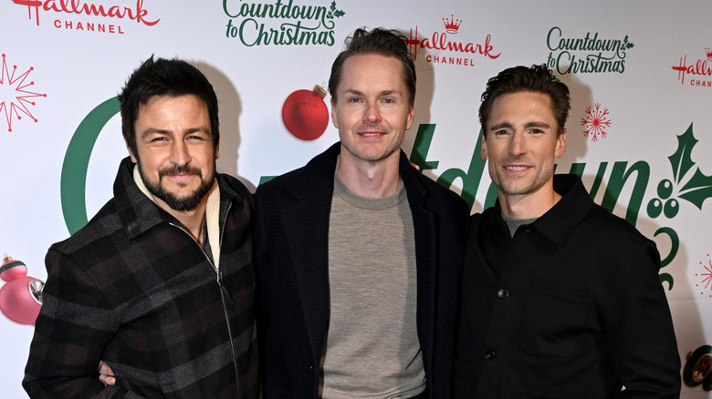 Tyler Hynes posing with Paul Campbell and Andrew Walker