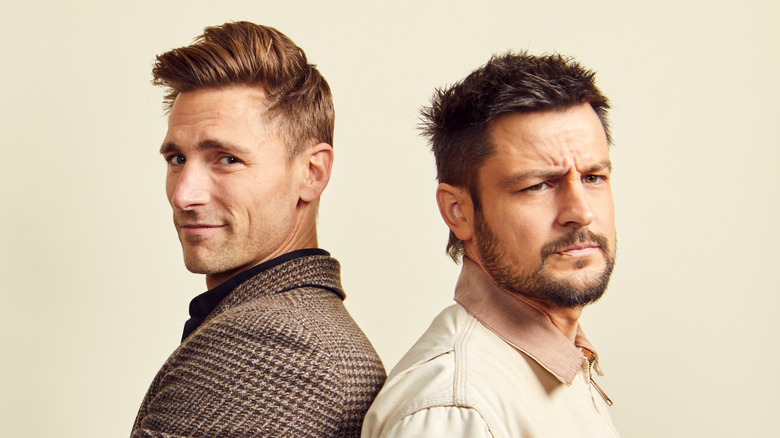 Andrew Walker posing back-to-back with Tyler Hynes