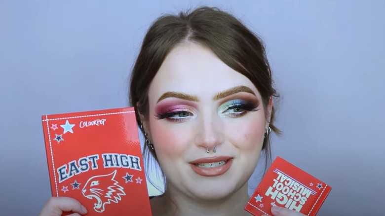 YouTuber Breyonna Faye holding High School Musical x ColourPop palette and wearing finished makeup look