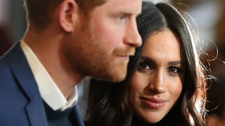 Prince Harry and Meghan Markle posing 